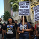 LOS ANGELES, CA - SEPTEMBER 22: Demonstrators burn their student loan bills on the Hollywood Walk of Fame to protest the rising cost of high education on September 22, 2012 in the Hollywood section of Los Angeles, California. (Photo by David McNew/Getty Images)